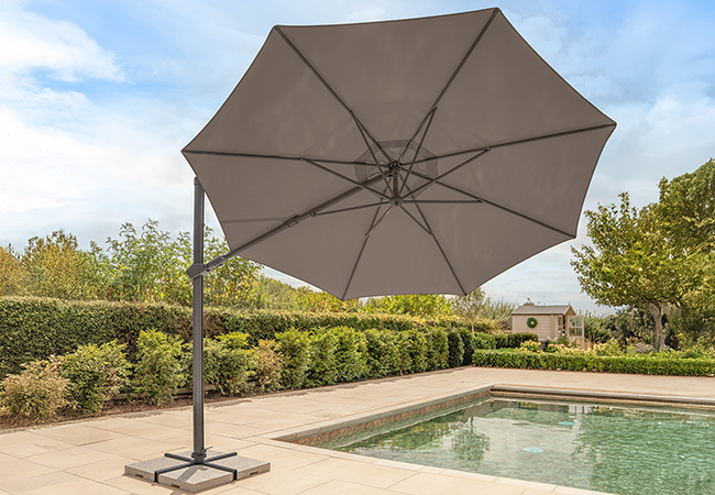 Image of Kettler Orion 3.0m Round LED Cantilever Parasol with Side Tilt, Granite Base & Night Cover - Grey Frame / Taupe Canopy