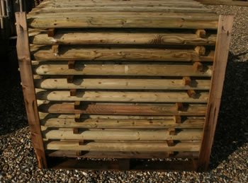 Image of Pack of 10 1.2m (4ft) tall, 50mm diameter treated Round Wooden Fence Posts