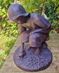 Small Image of Boy Playing with Frog Garden Ornament